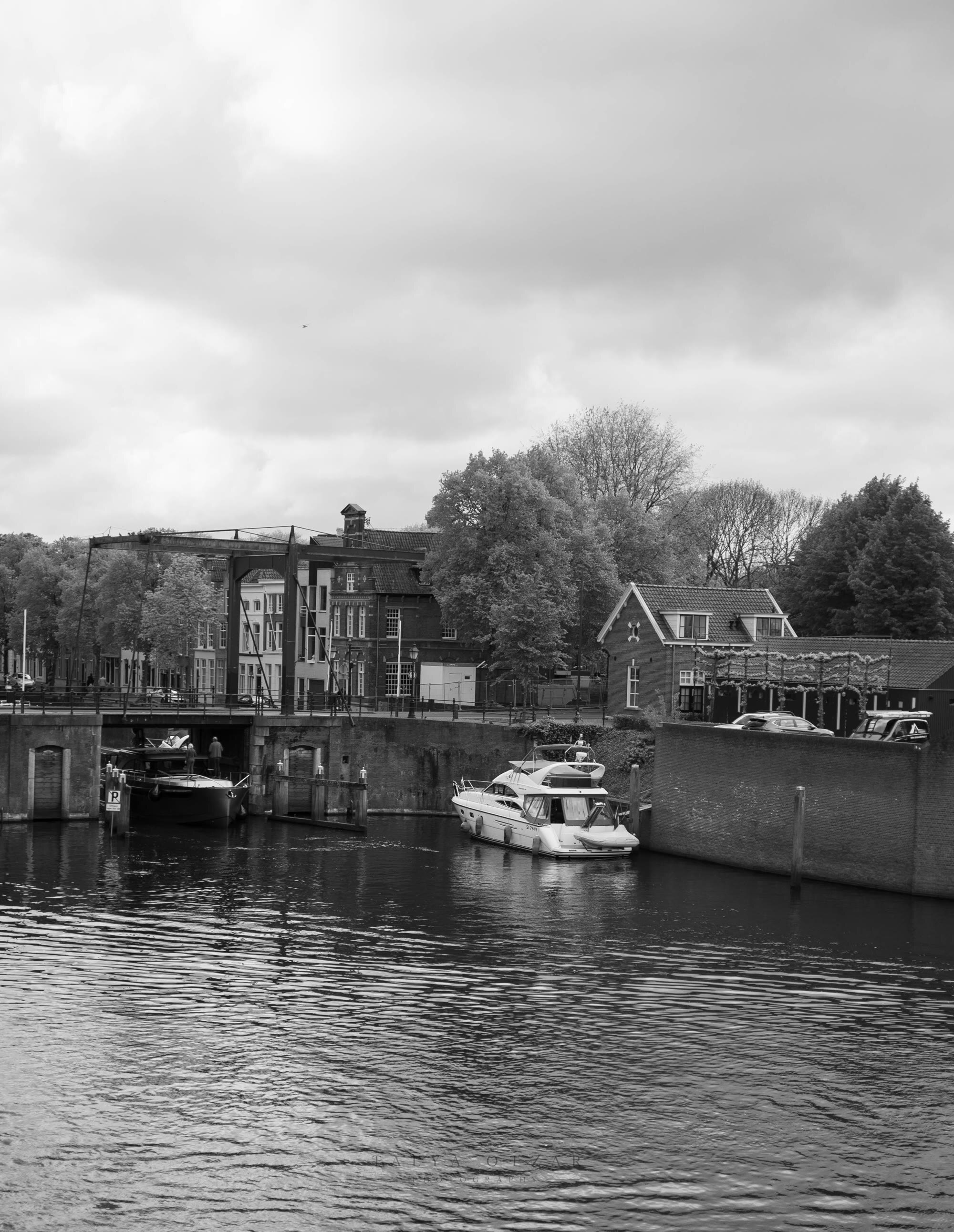 A motor yacht waiting in the lock beside the drawbridge
