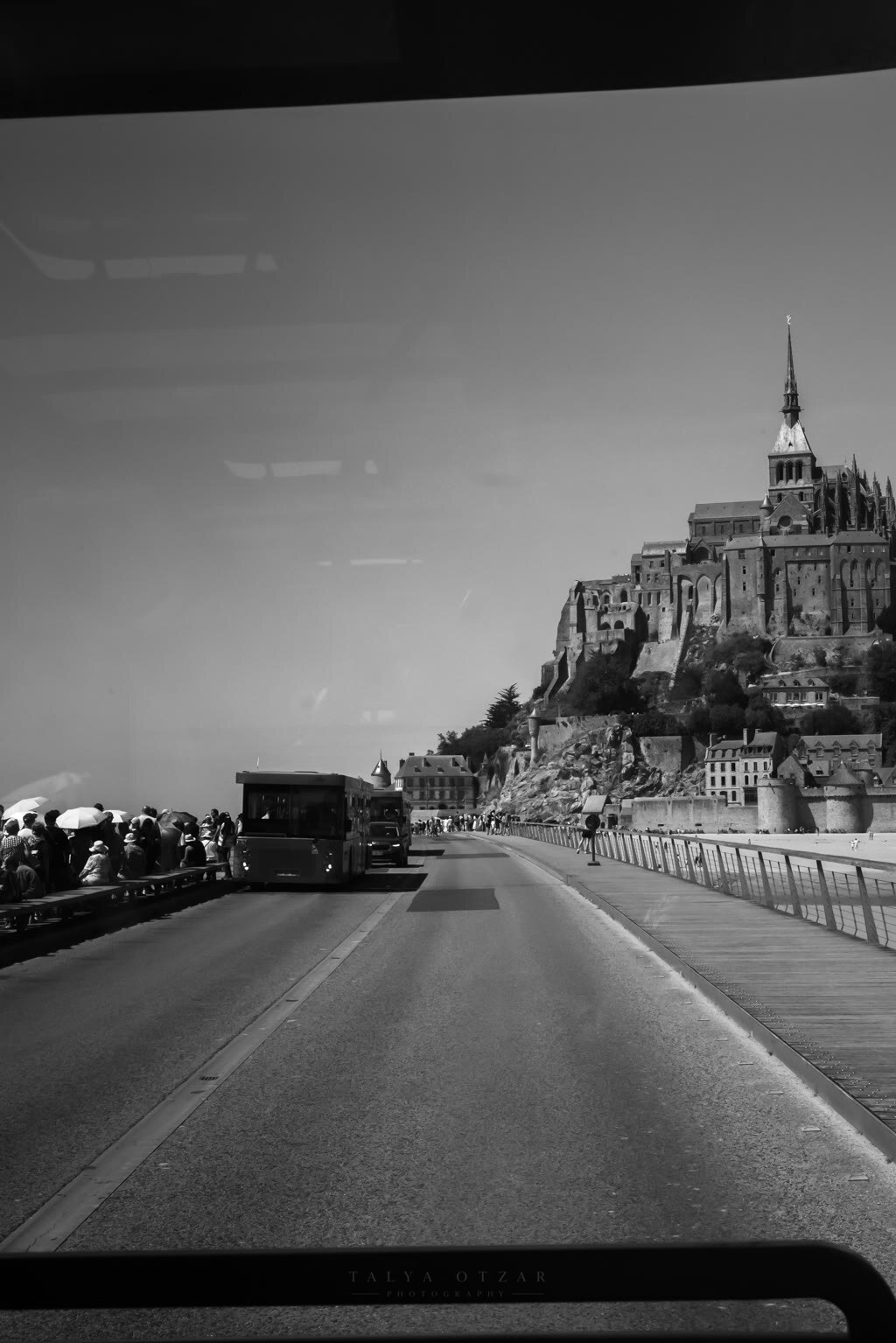 The causeway out to Mont-Saint-Michel seen through the car windscreen