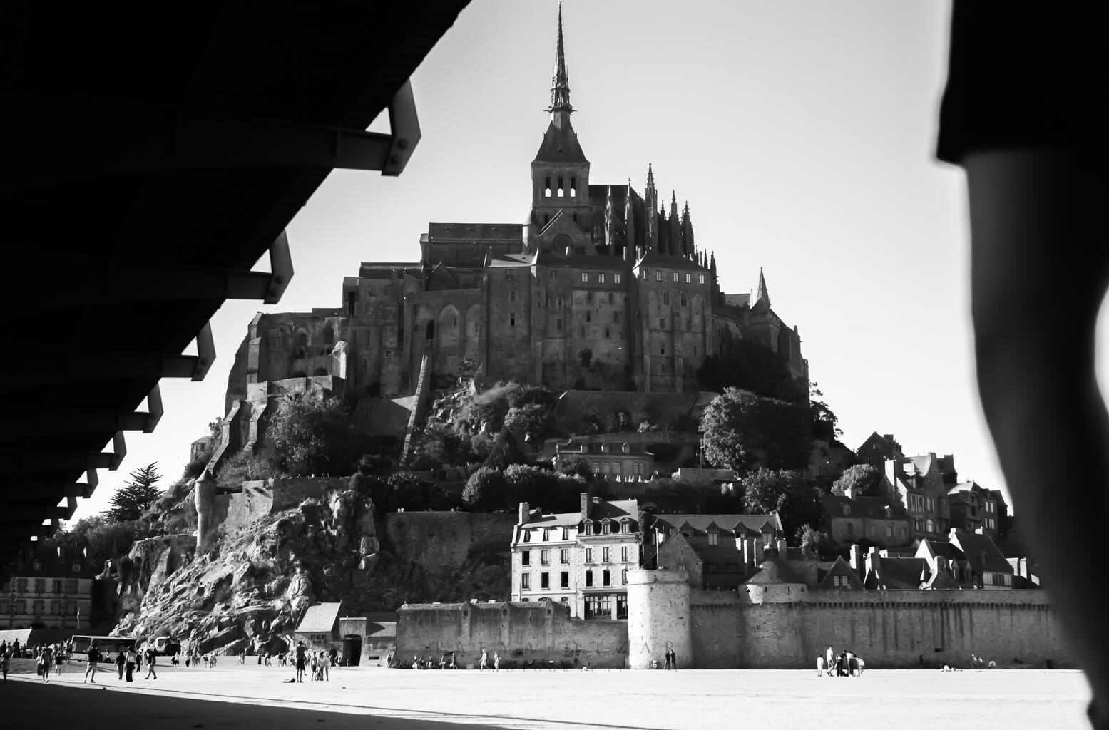 Mont-Saint-Michel framed from beneath the causeway bridge